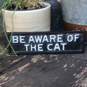 Be aware of the cat cast iron sign